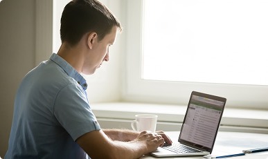 Person checking home details on laptop